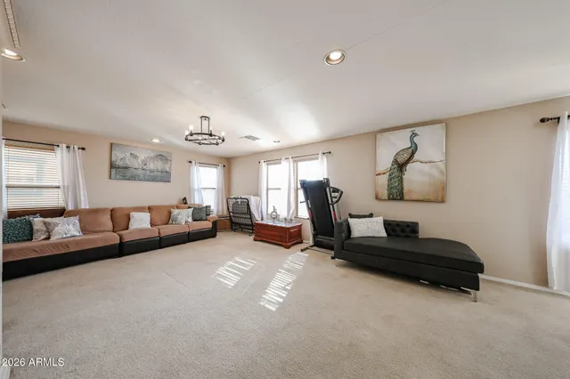 a bedroom with furniture and a window