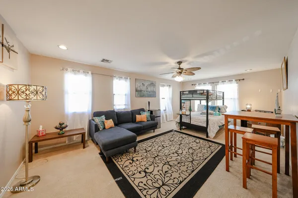 a building outdoor space with patio furniture and potted plants