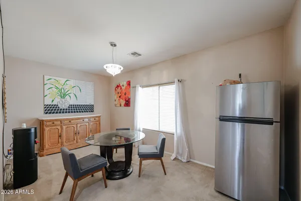 a dining room with furniture and window