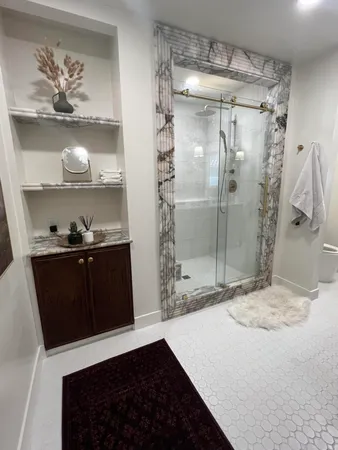a bathroom with a bathtub and a shower