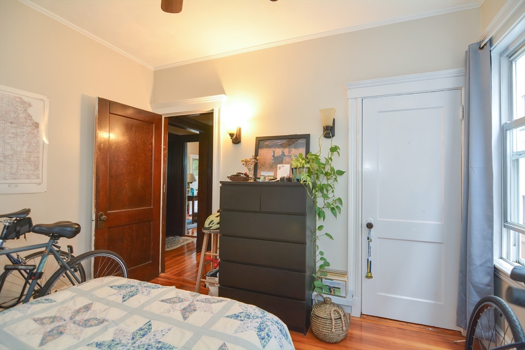 94 Browne Street Brookline, MA 02446 - Photo 15 of 35 a bedroom with a bed and a table in it