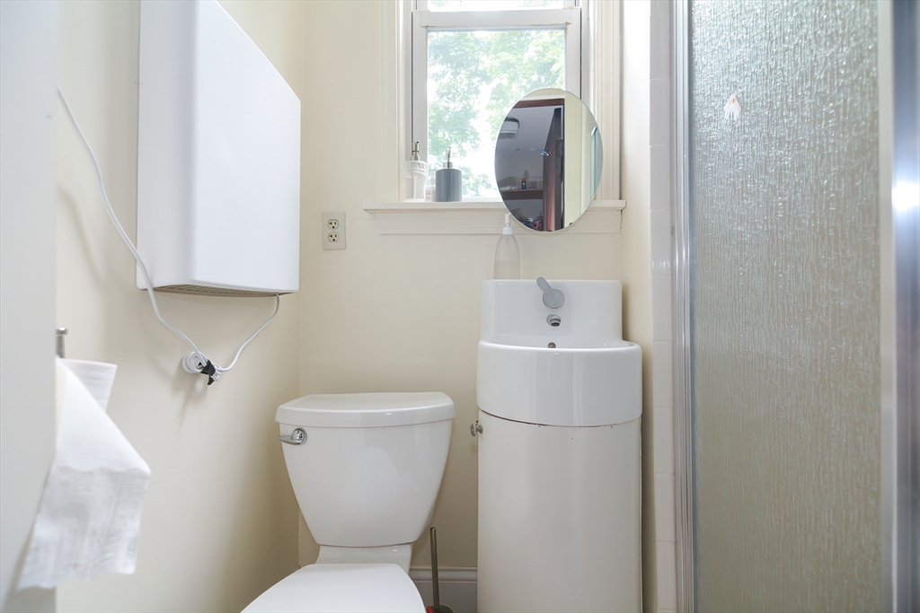 94 Browne Street Brookline, MA 02446 - Photo 18 of 35 a white toilet sitting next to a white sink