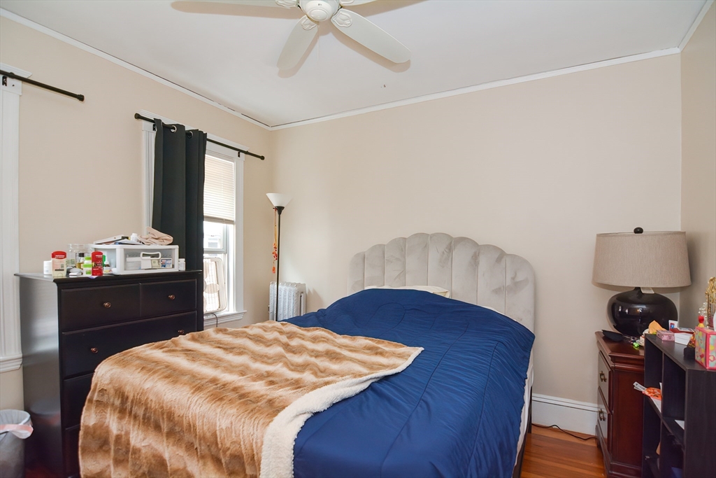 94 Browne Street Brookline, MA 02446 - Photo 24 of 35 a bedroom with a bed and a dresser