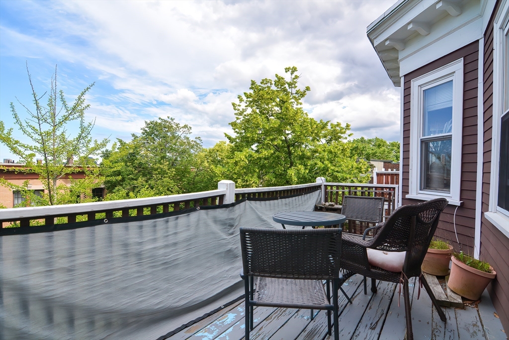 94 Browne Street Brookline, MA 02446 - Photo 27 of 35 a balcony with table and chairs