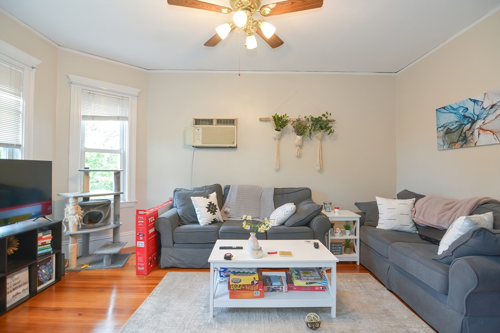 94 Browne Street Brookline, MA 02446 - Photo 28 of 35 a living room with furniture and a flat screen tv