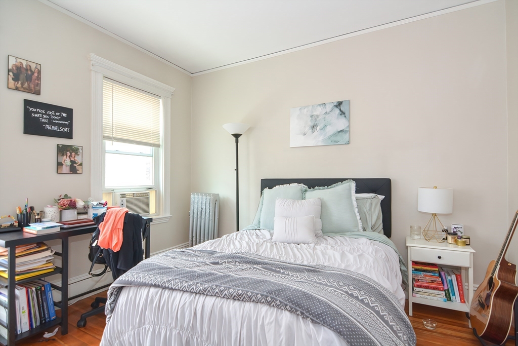 94 Browne Street Brookline, MA 02446 - Photo 30 of 35 a bedroom with a bed and wooden floor