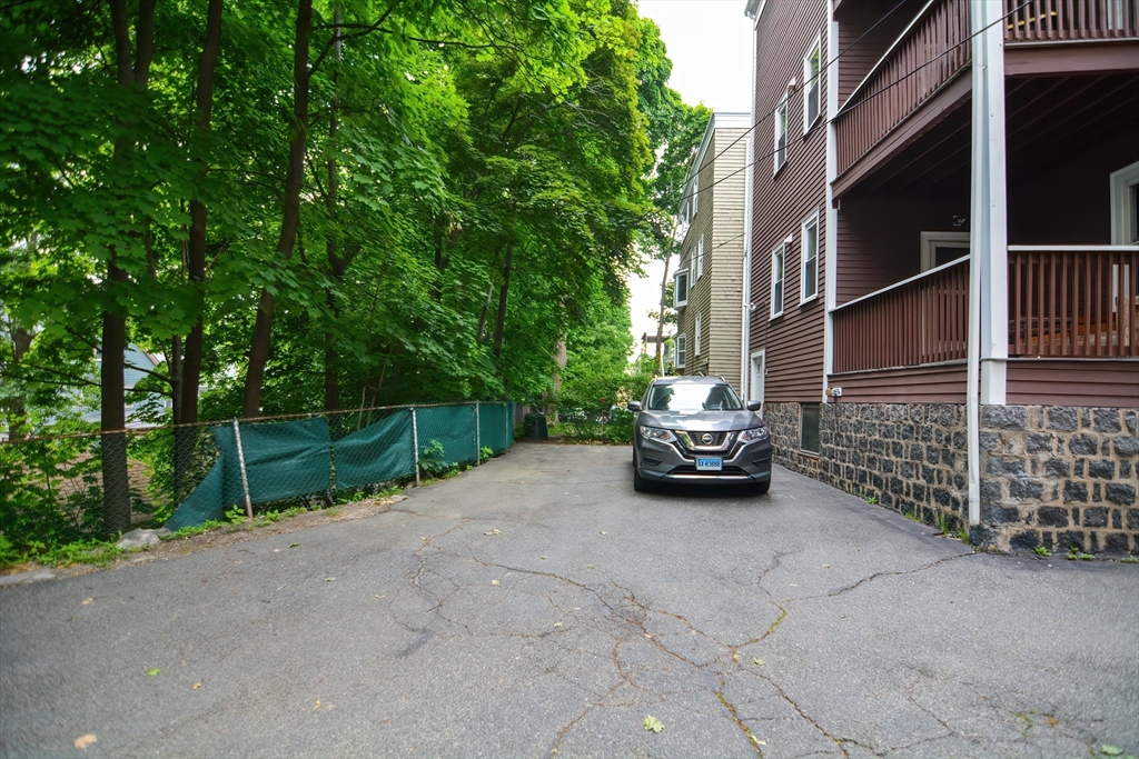 94 Browne Street Brookline, MA 02446 - Photo 3 of 35 a car parked in front of a house