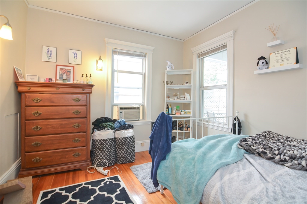 94 Browne Street Brookline, MA 02446 - Photo 34 of 35 a bedroom with a bed and a dresser