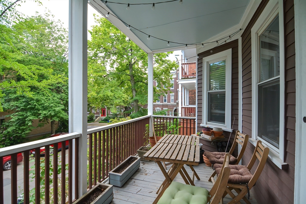 94 Browne Street Brookline, MA 02446 - Photo 5 of 35 a view of a chairs and table in the balcony