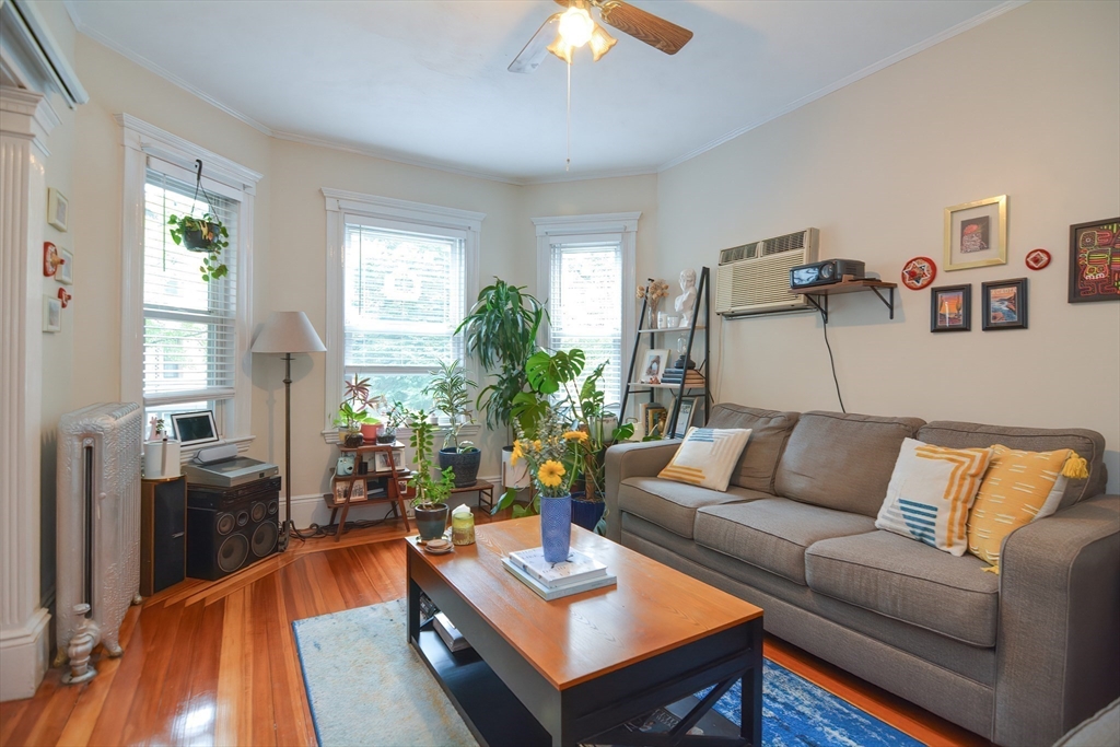 94 Browne Street Brookline, MA 02446 - Photo 6 of 35 a living room with furniture and a large window