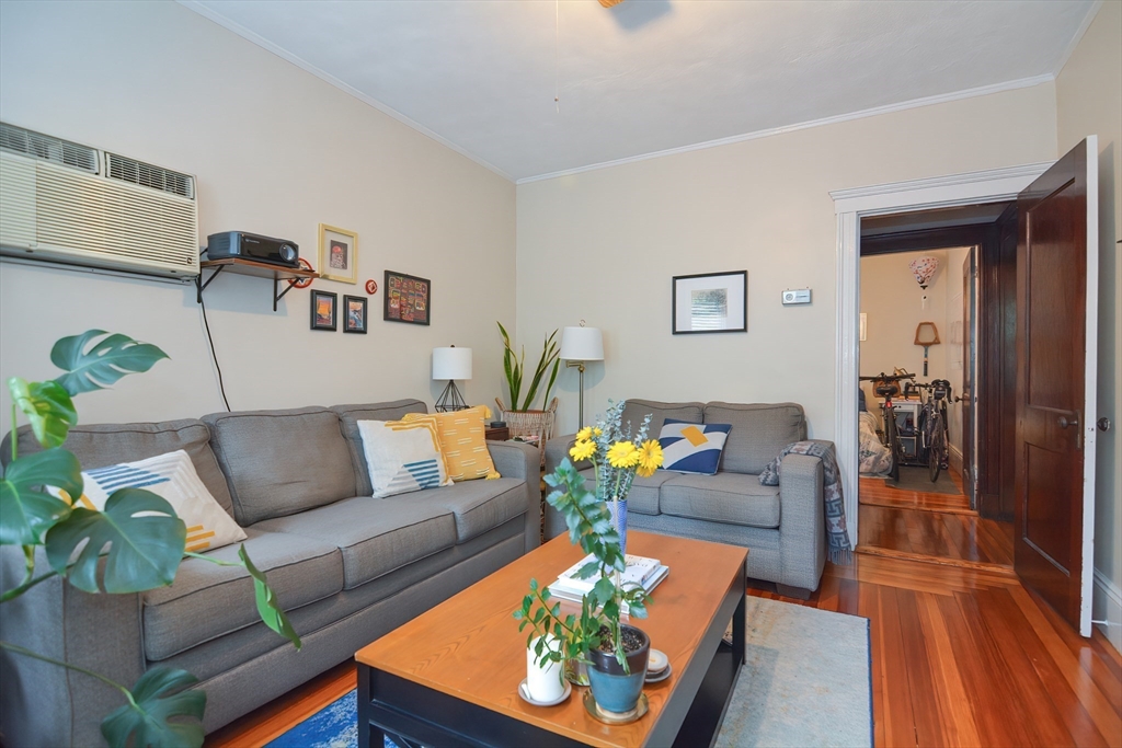 94 Browne Street Brookline, MA 02446 - Photo 7 of 35 a living room with furniture and wooden floor