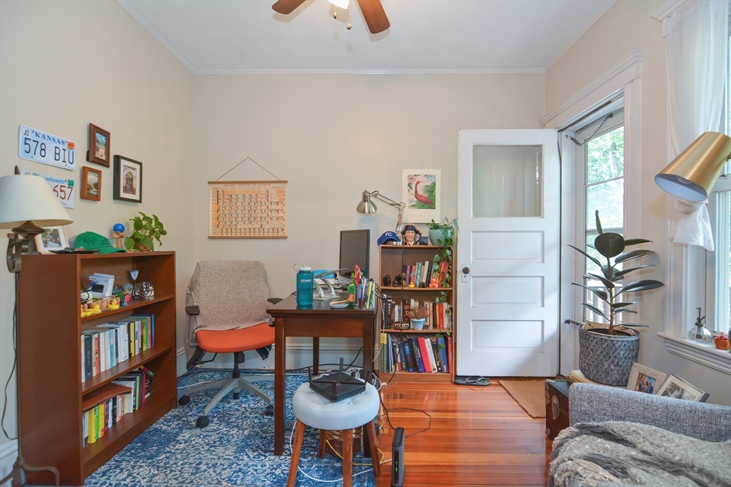 94 Browne Street Brookline, MA 02446 - Photo 9 of 35 a living room with furniture and a book shelf