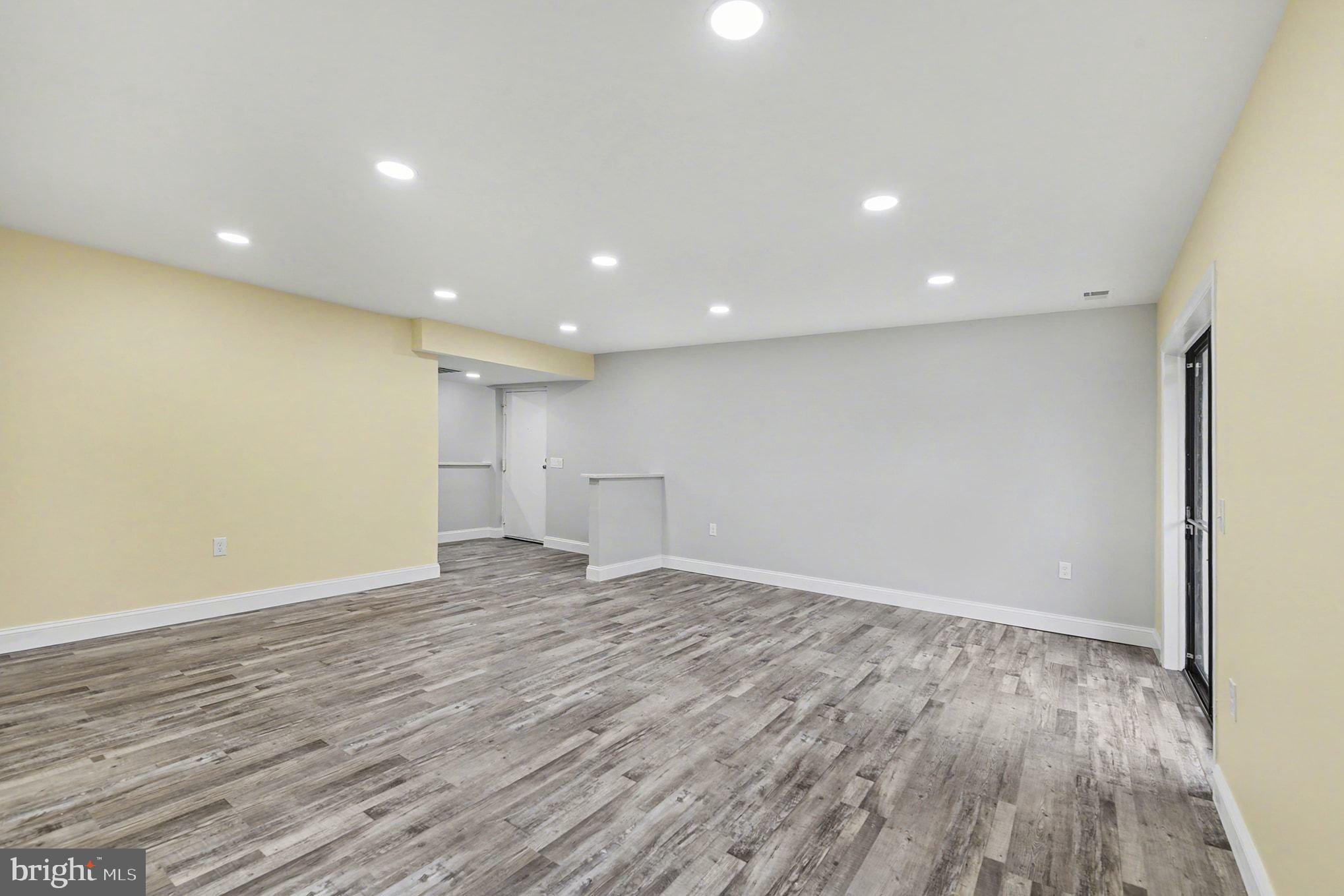 2 Winners Circle, Unit 1B Owings Mills, MD 21117 - Photo 12 of 39 a view of an empty room with wooden floor