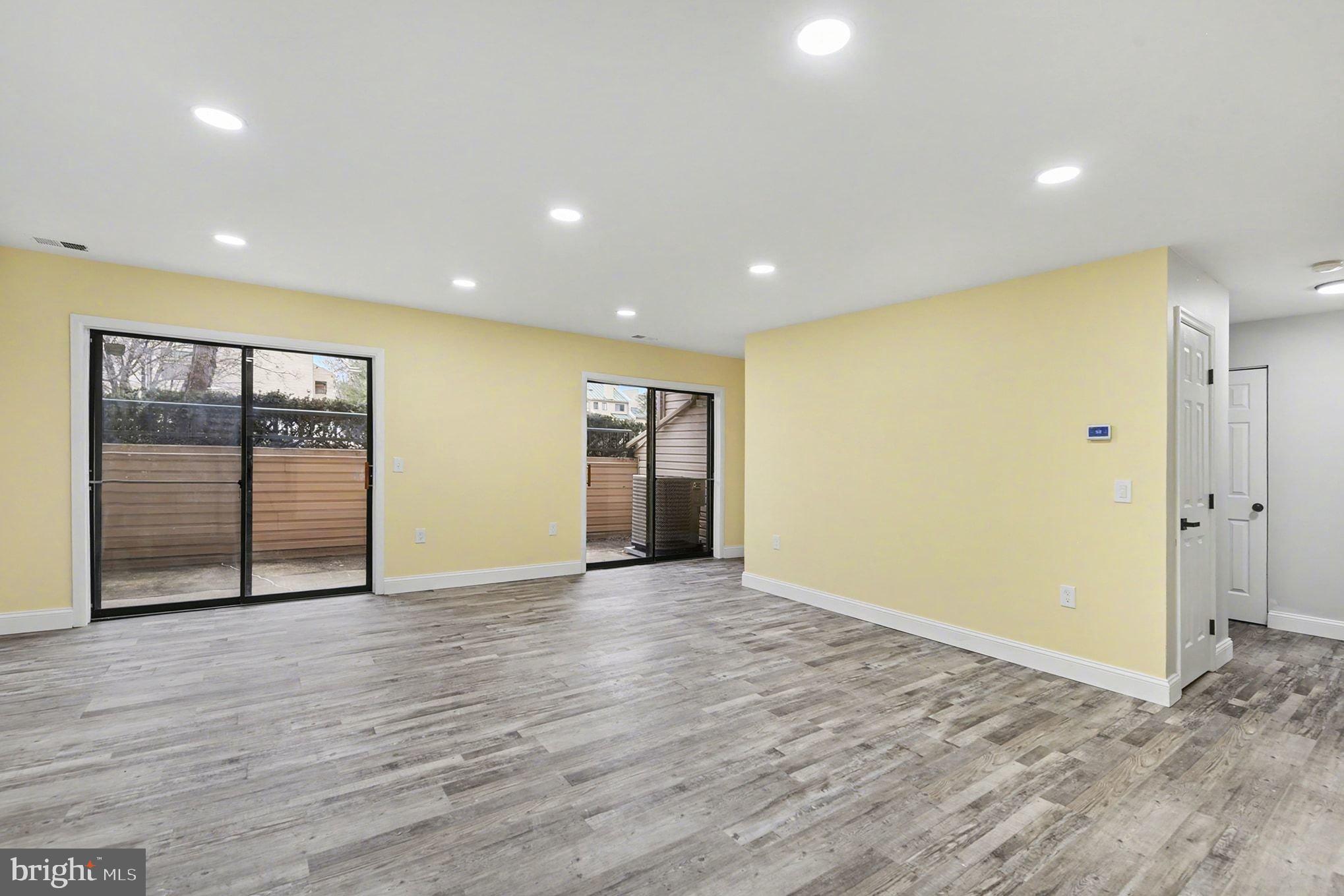 2 Winners Circle, Unit 1B Owings Mills, MD 21117 - Photo 13 of 39 an empty room with wooden floor and windows