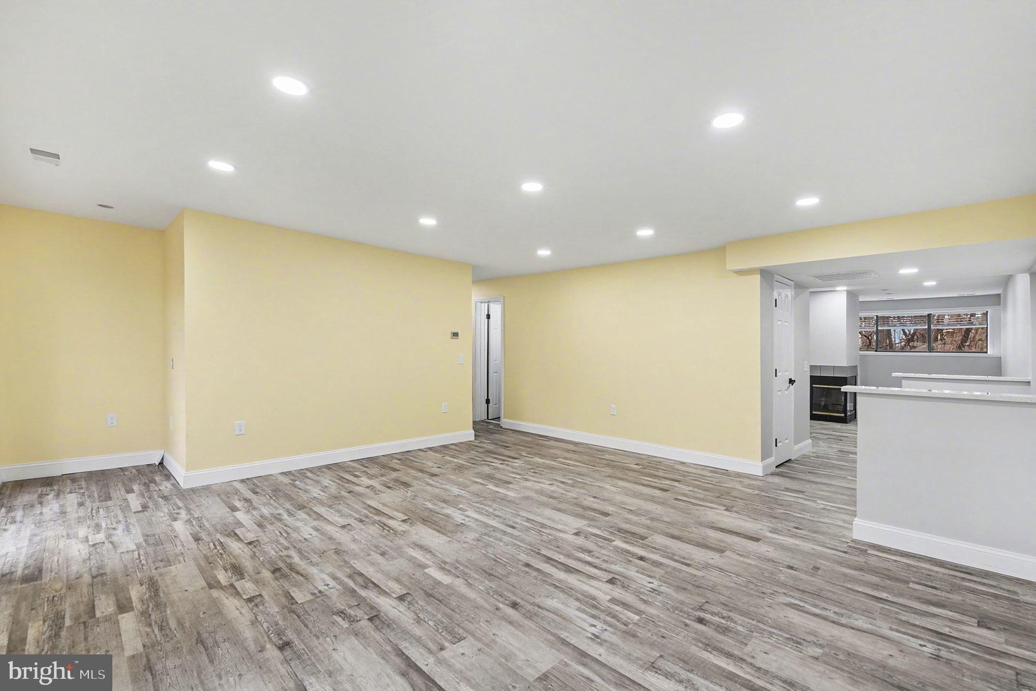 2 Winners Circle, Unit 1B Owings Mills, MD 21117 - Photo 14 of 39 a view of empty room with wooden floor