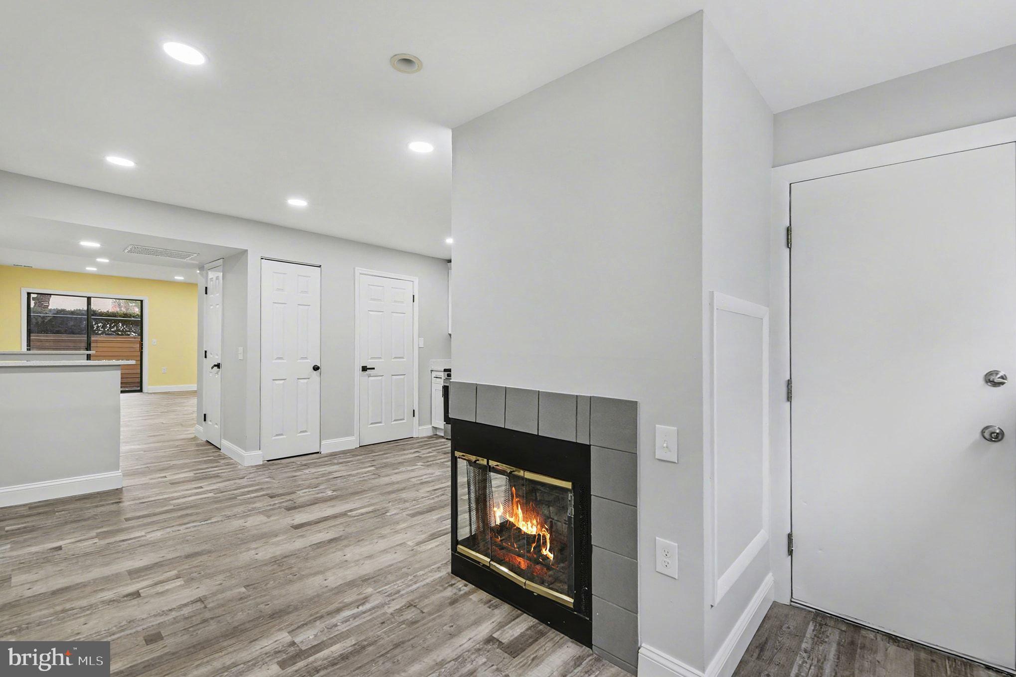 2 Winners Circle, Unit 1B Owings Mills, MD 21117 - Photo 17 of 39 a view of an empty room with wooden floor and a fireplace