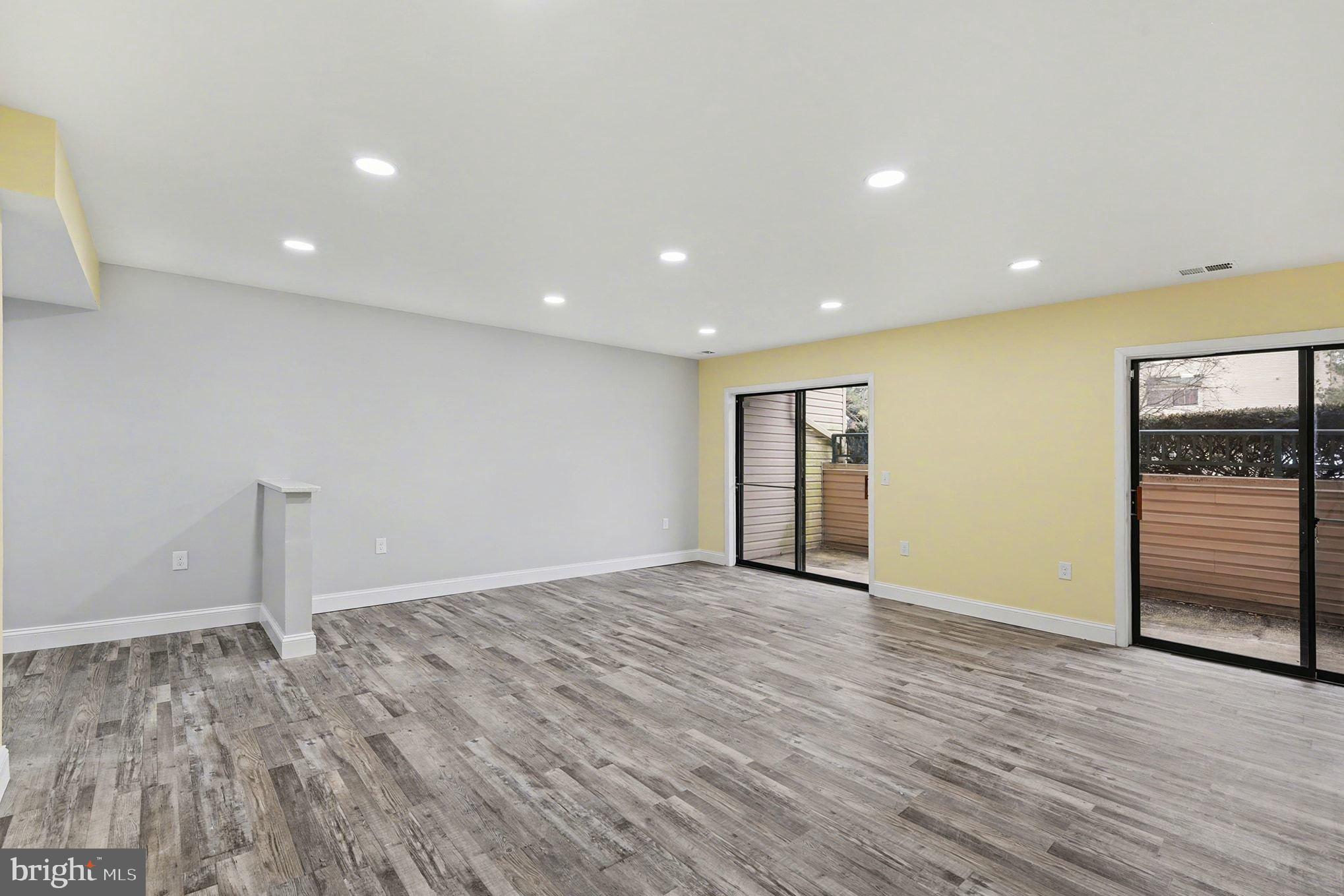2 Winners Circle, Unit 1B Owings Mills, MD 21117 - Photo 19 of 39 a view of an empty room with wooden floor and closet