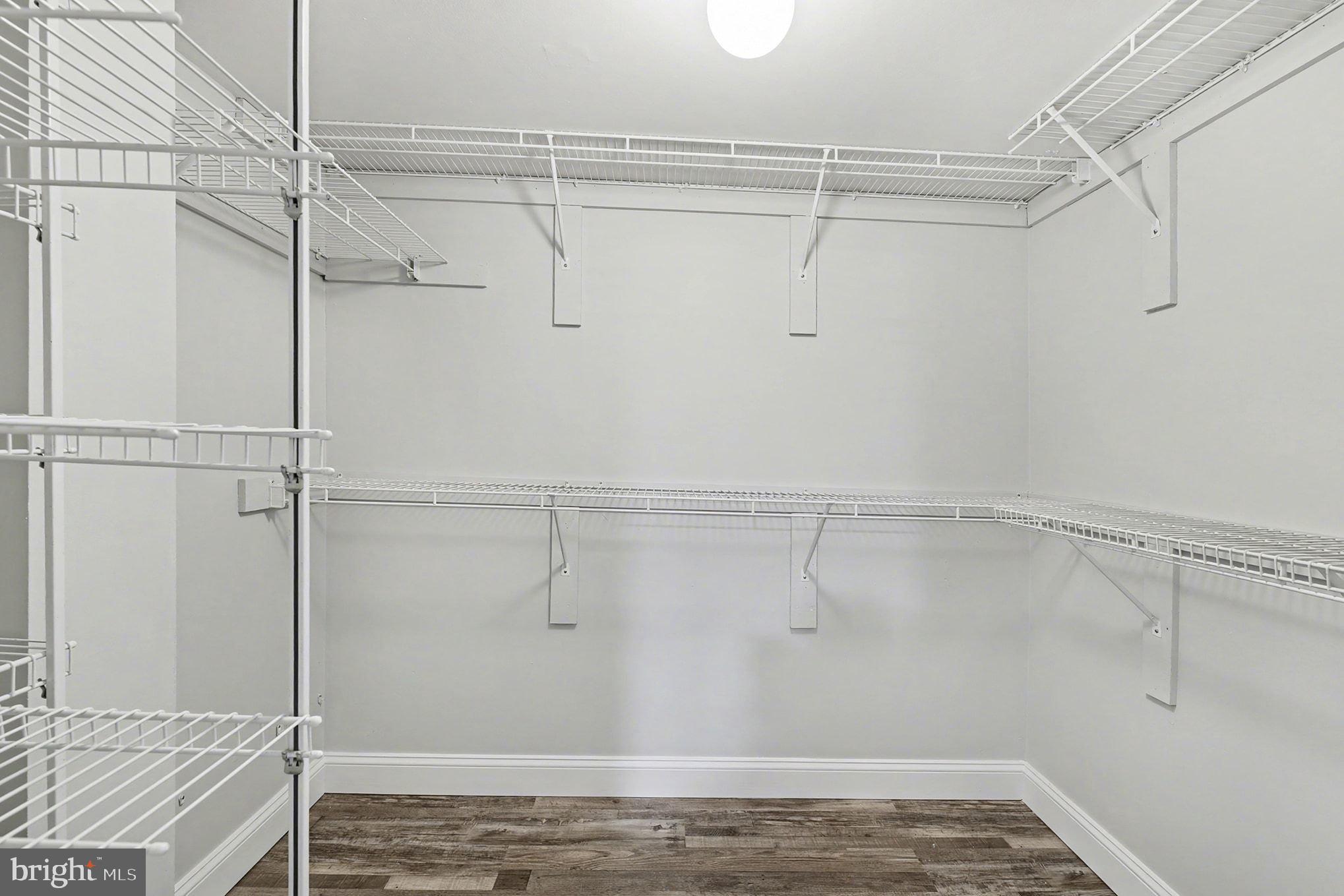 2 Winners Circle, Unit 1B Owings Mills, MD 21117 - Photo 23 of 39 a view of a room with racks on the wall