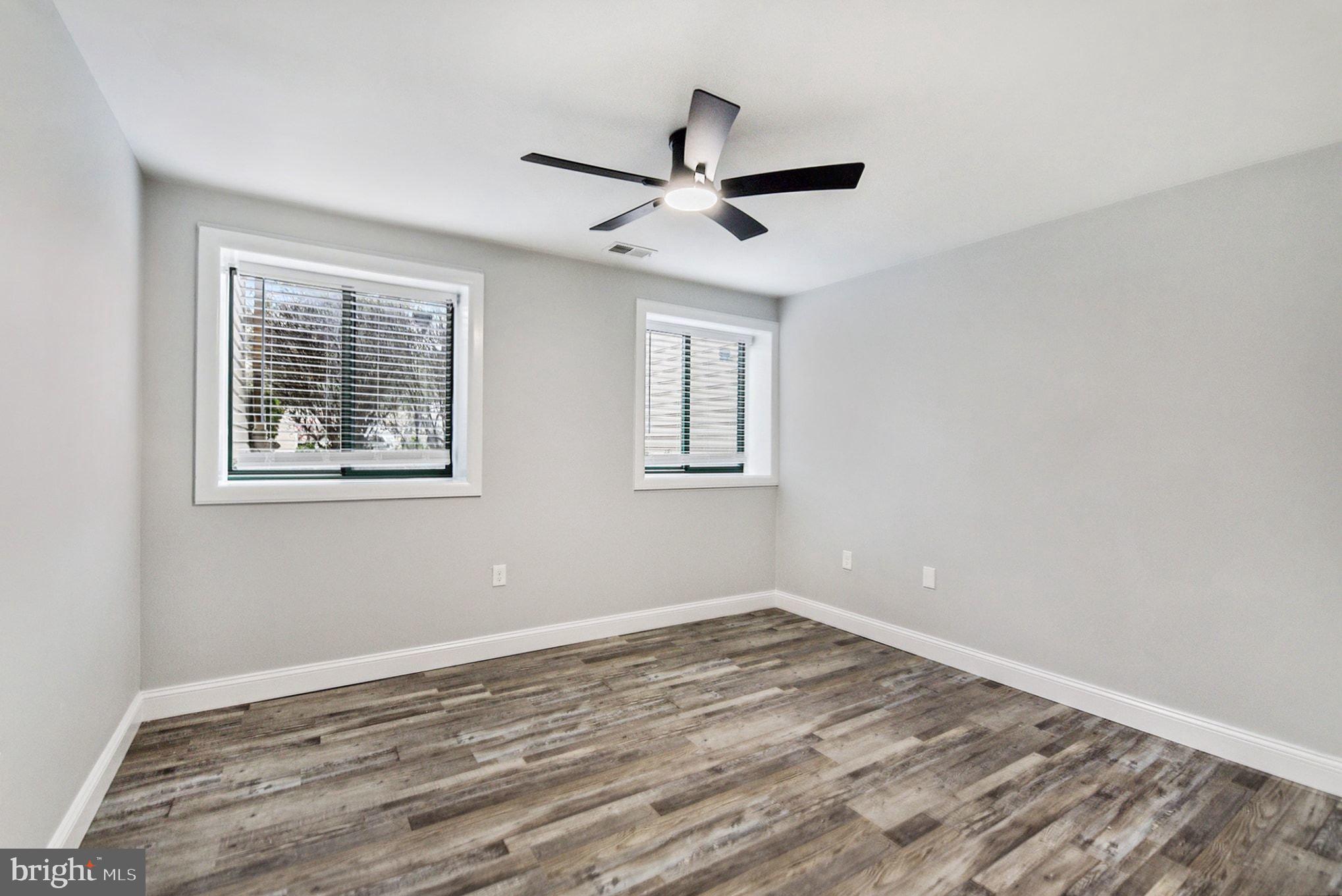 2 Winners Circle, Unit 1B Owings Mills, MD 21117 - Photo 25 of 39 a view of empty room with wooden floor and fan