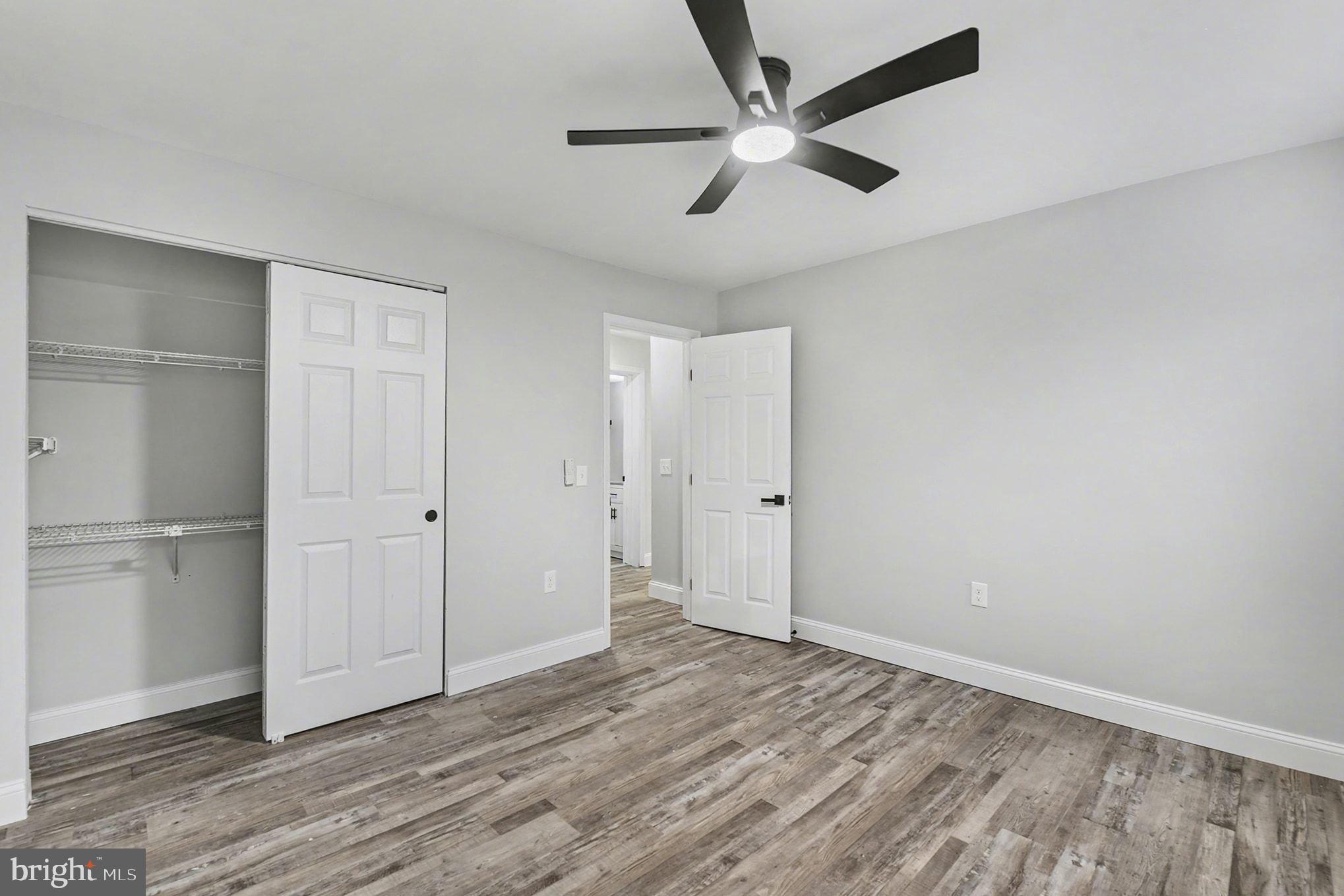 2 Winners Circle, Unit 1B Owings Mills, MD 21117 - Photo 26 of 39 a view of an empty room and wooden floor