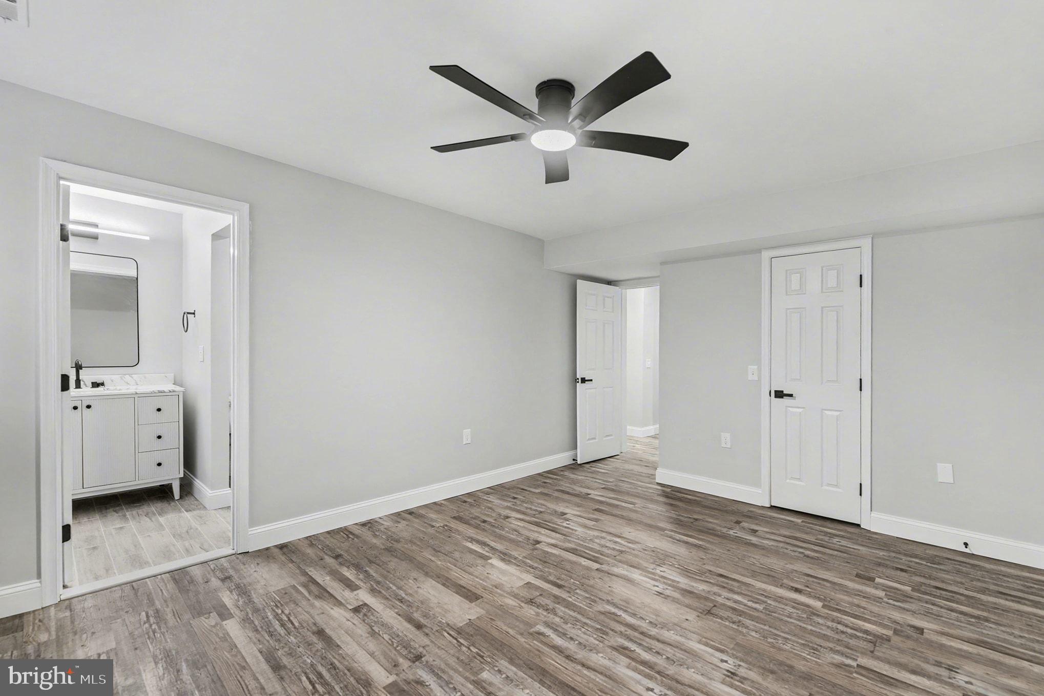 2 Winners Circle, Unit 1B Owings Mills, MD 21117 - Photo 29 of 39 a view of a livingroom with wooden floor