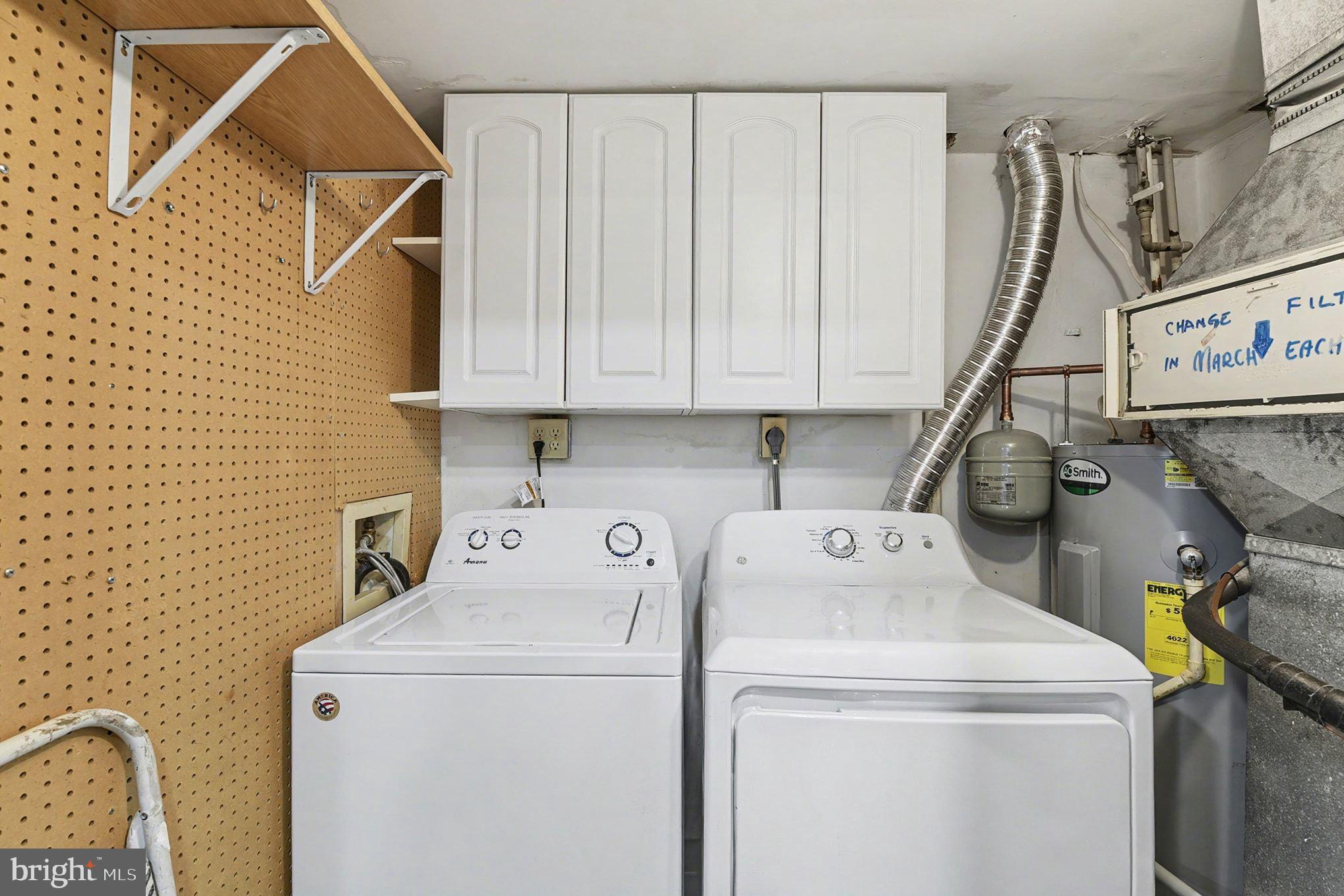 2 Winners Circle, Unit 1B Owings Mills, MD 21117 - Photo 31 of 39 a utility room with dryer and washer
