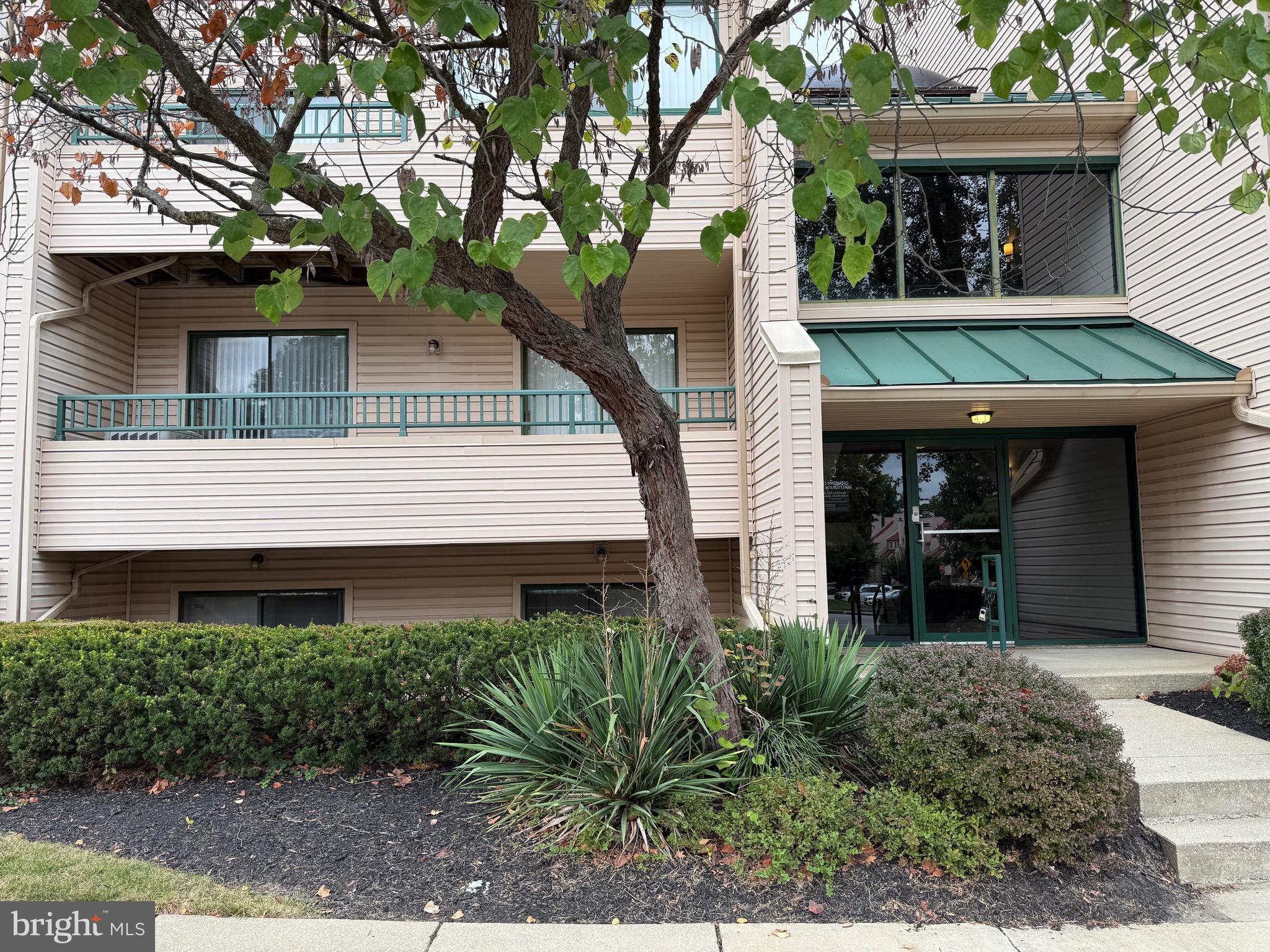 2 Winners Circle, Unit 1B Owings Mills, MD 21117 - Photo 6 of 39 a front view of a house with garden