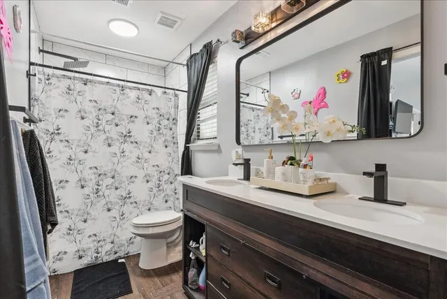 a bedroom with a bed and a desk