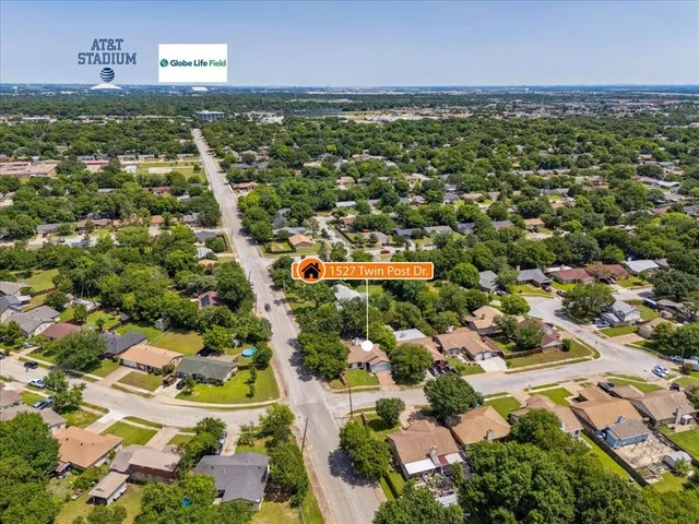 a view of a backyard with large trees