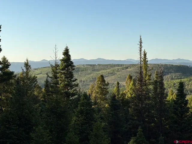 a view of a city with mountains in the background
