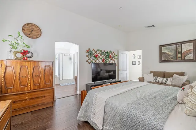 a spacious bathroom with a double vanity sink toilet mirror and bathtub