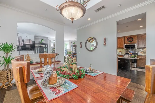 a view of a dining room and hall with furniture