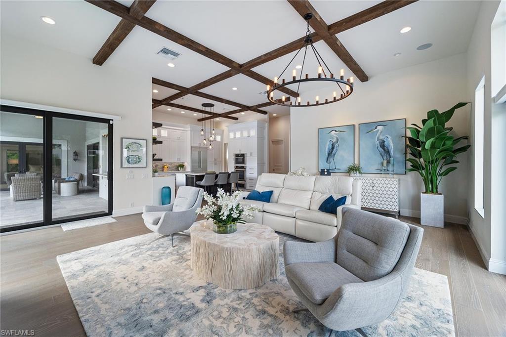 6582 Trail Boulevard Naples, FL 34108 - Photo 32 of 50 a living room with furniture