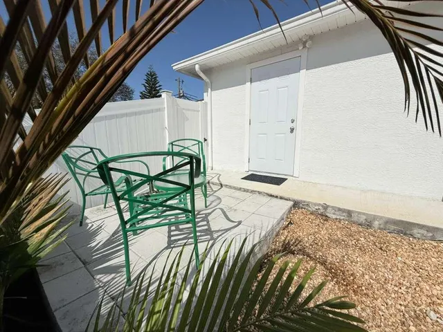 a view of a livingroom with furniture and staircase