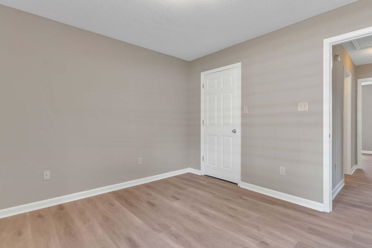 1088 Akins Store Road Munford, TN 38058 - Photo 24 of 40 a view of an empty room with wooden floor