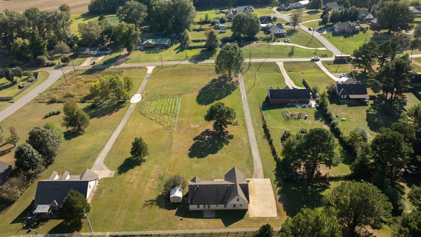 1088 Akins Store Road Munford, TN 38058 - Photo 36 of 40 an aerial view of a house with a swimming pool