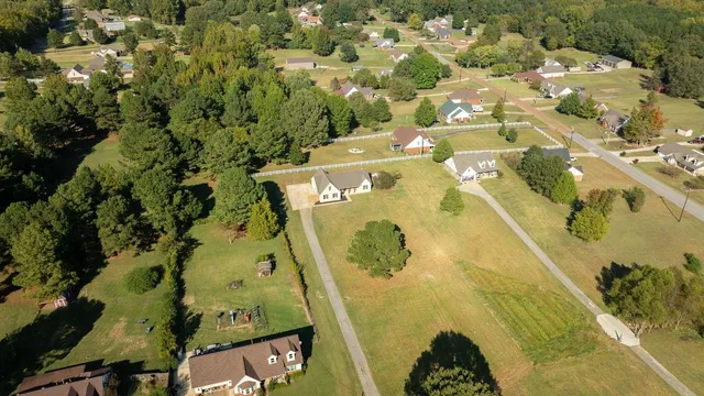 an aerial view of residential house with swimming pool