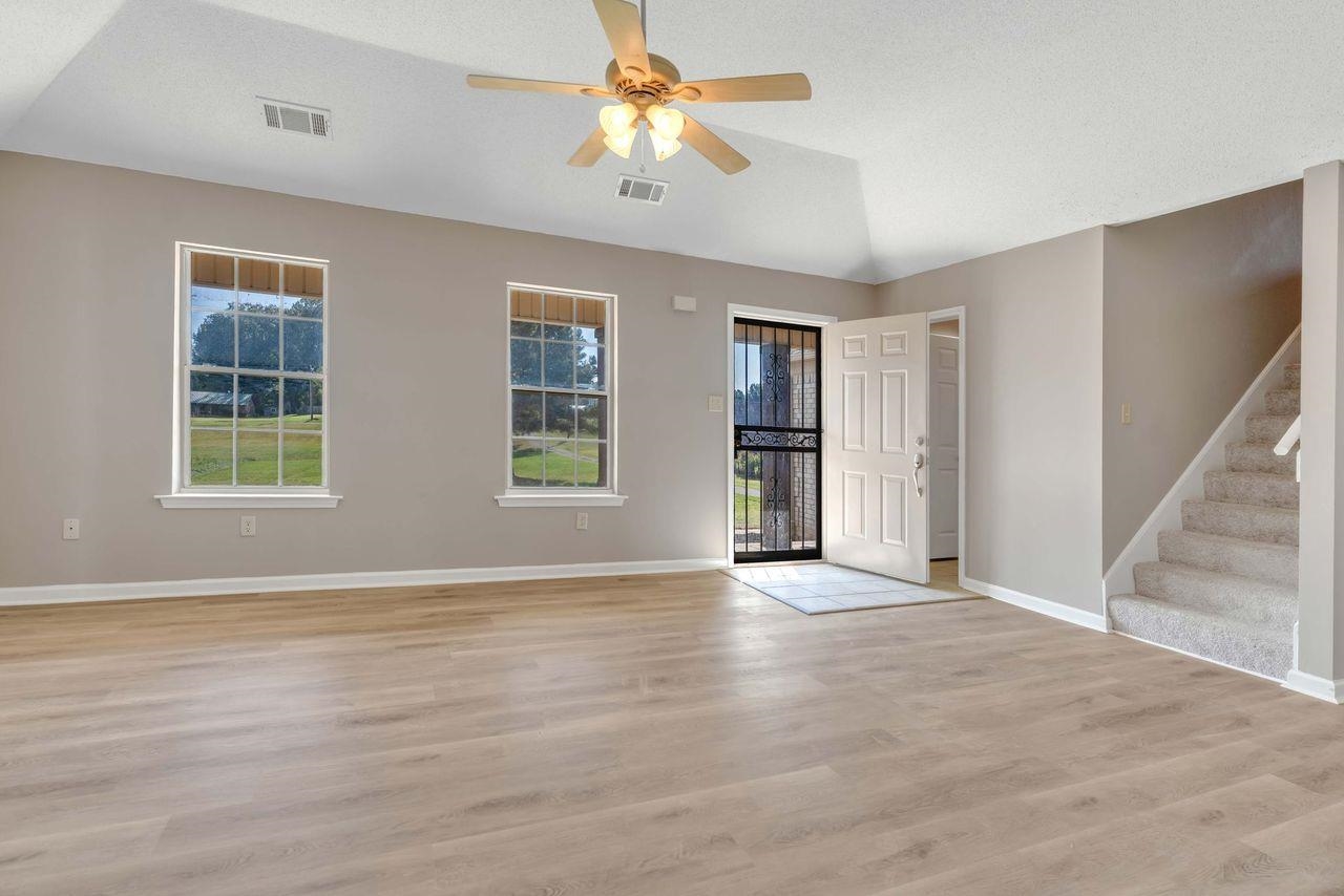 1088 Akins Store Road Munford, TN 38058 - Photo 6 of 40 a view of an empty room with window and wooden floor
