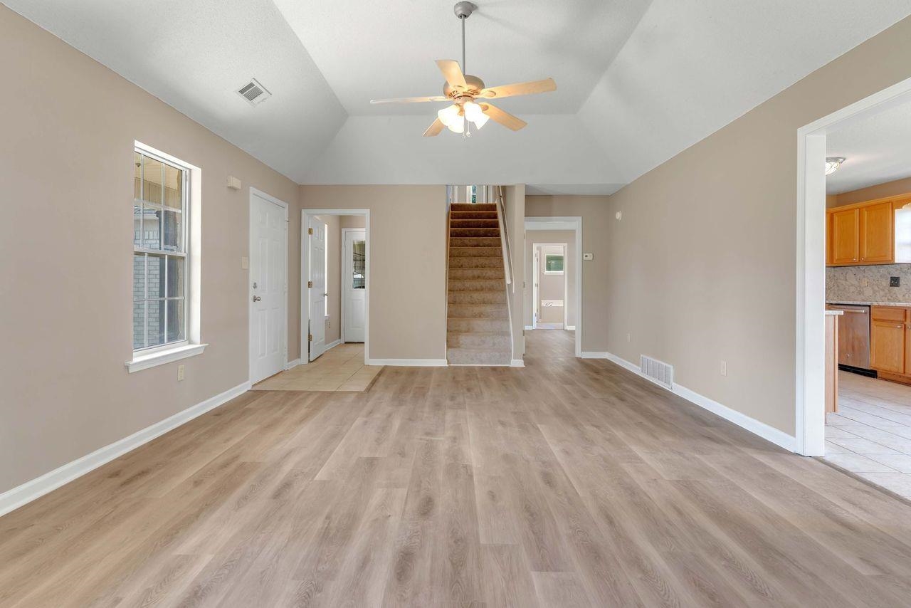 1088 Akins Store Road Munford, TN 38058 - Photo 7 of 40 wooden floor in an empty room with a window