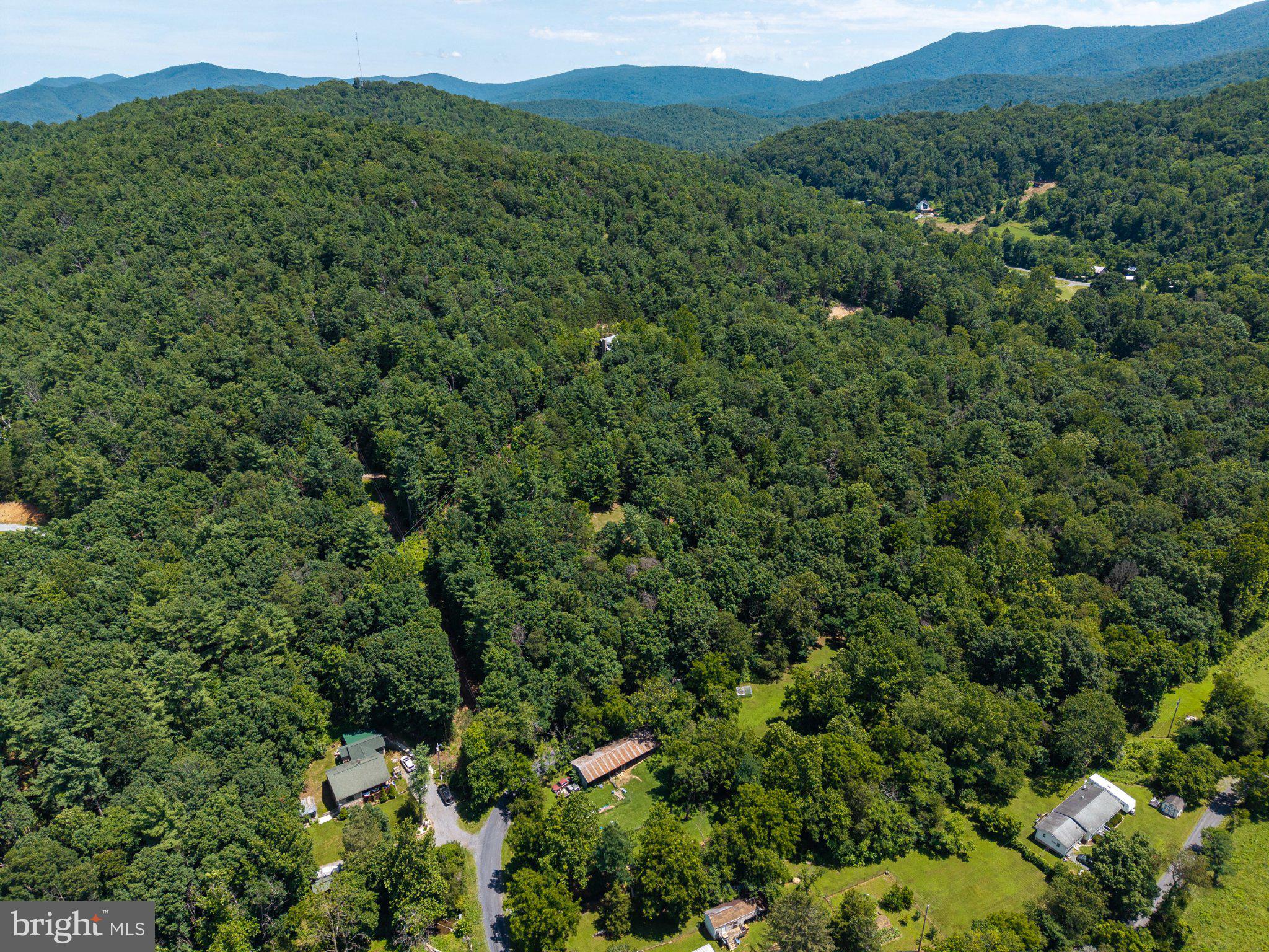 Lot 4 Somers Road Luray, VA 22835 - Photo 10 of 20 Lush green hills embrace serene homes.