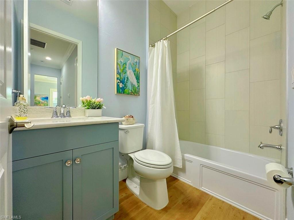 7270 Saona Court Naples, FL 34113 - Photo 13 of 46 a bathroom with a sink toilet and shower