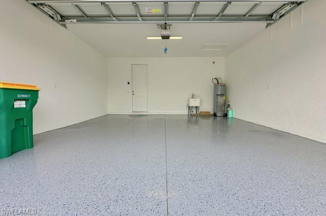 7270 Saona Court Naples, FL 34113 - Photo 15 of 46 a view of a livingroom with a chair and a ceiling fan