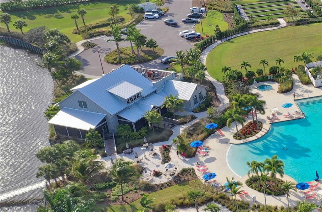 7270 Saona Court Naples, FL 34113 - Photo 21 of 46 an aerial view of a house with a swimming pool and outdoor seating