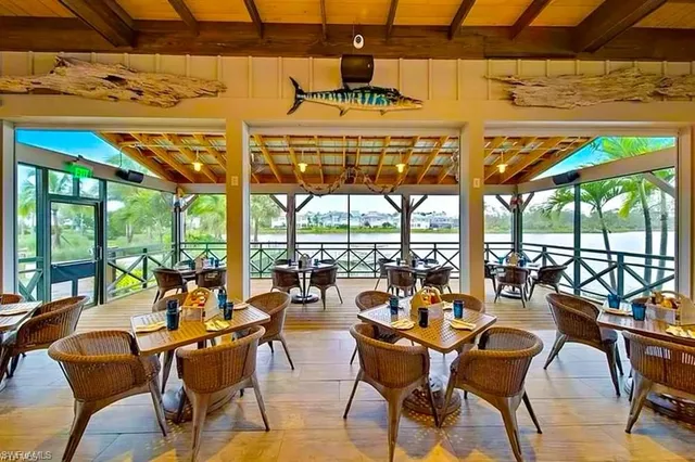 a view of a swimming pool with outdoor seating