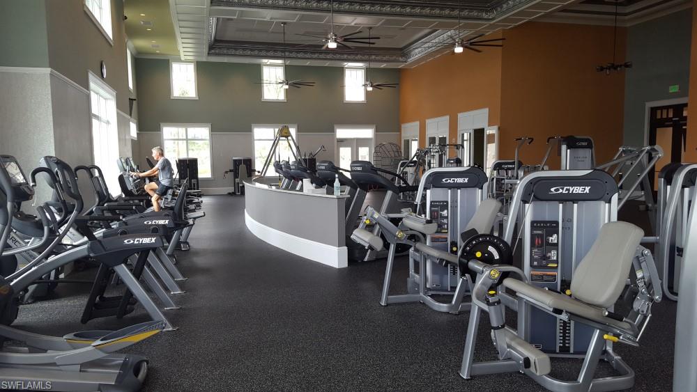 7270 Saona Court Naples, FL 34113 - Photo 26 of 46 a view of a room with gym equipment