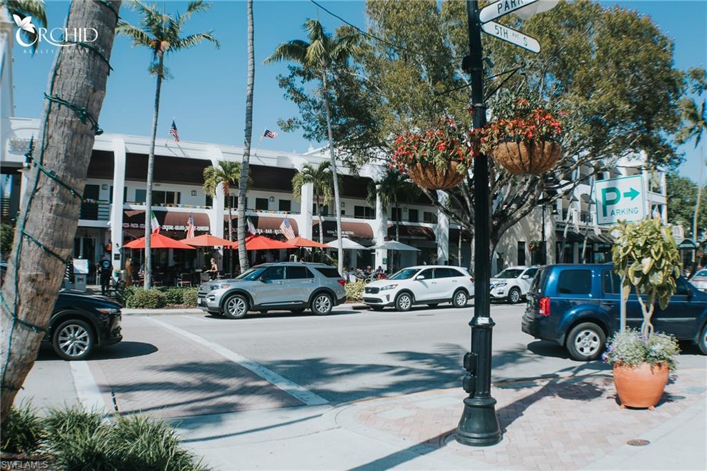 7270 Saona Court Naples, FL 34113 - Photo 42 of 46 a view of street with parked cars