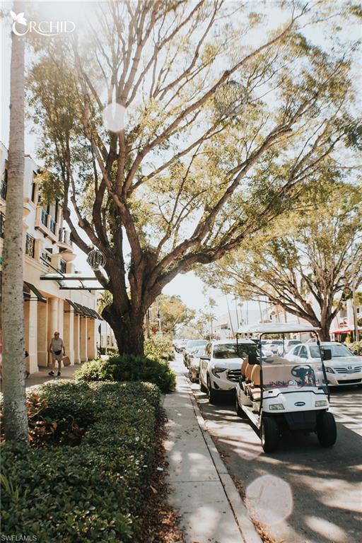 7270 Saona Court Naples, FL 34113 - Photo 44 of 46 a couple of cars parked in front of a house