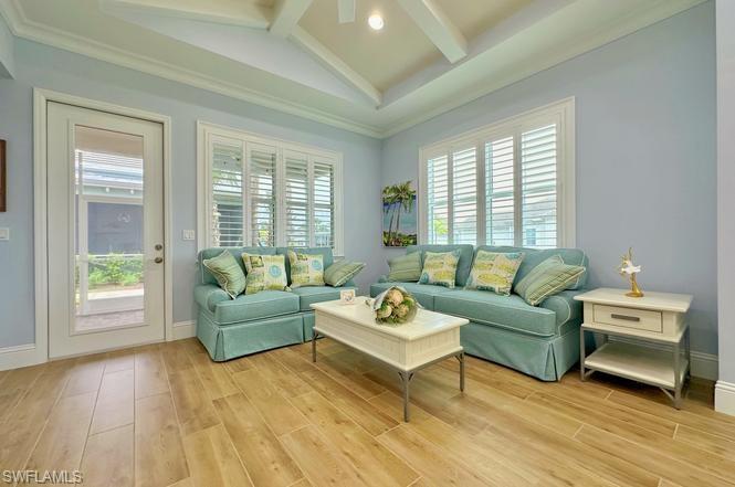 7270 Saona Court Naples, FL 34113 - Photo 6 of 46 a living room with furniture and a large window