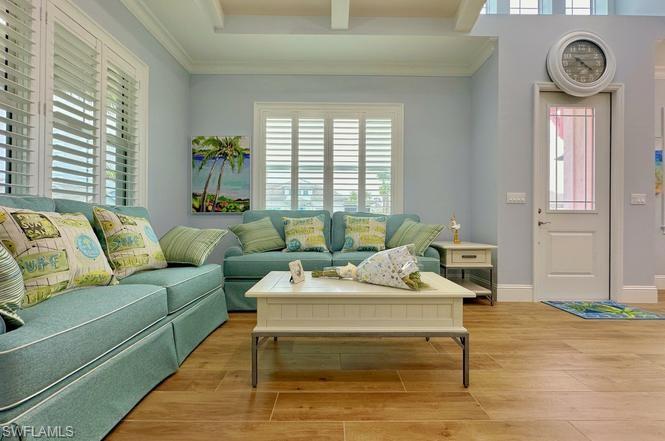 7270 Saona Court Naples, FL 34113 - Photo 7 of 46 a living room with furniture and a window