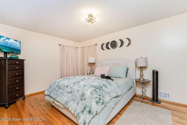 a bedroom with a bed and dresser